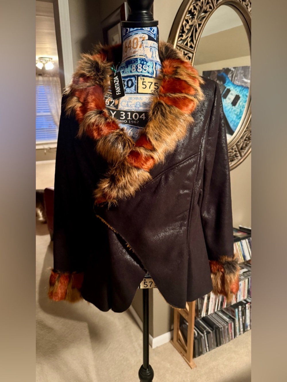 Dark brown pleather , faux fur lined , never worn . Trimmed in faux fur collar